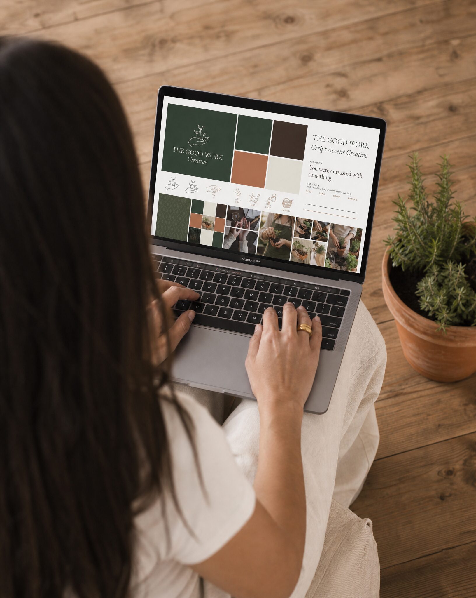 Woman working on MacBook, representing consistent Kingdom business branding and faith-aligned brand strategy
